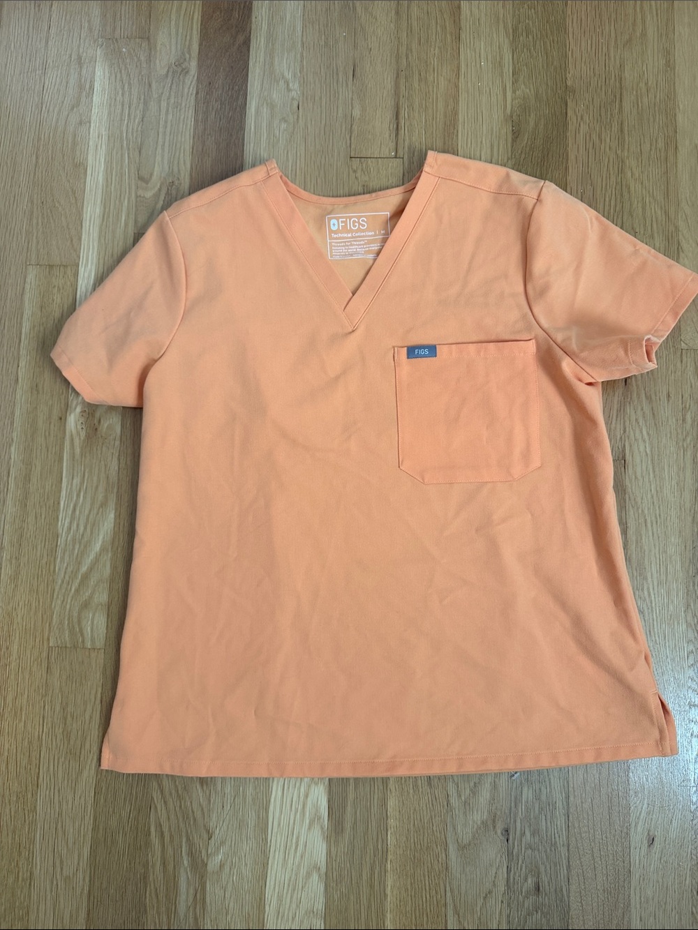 FIGS women’s Orange V-Neck Pocket Scrub Top